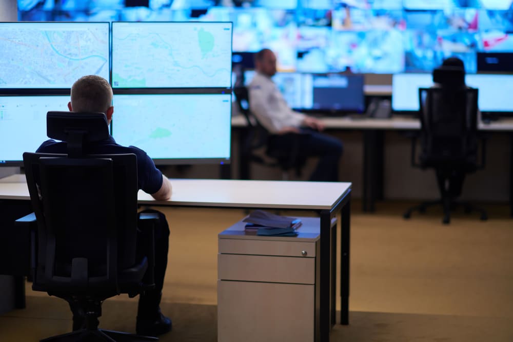 Male,Security,Operator,Working,In,A,Data,System,Control,Room