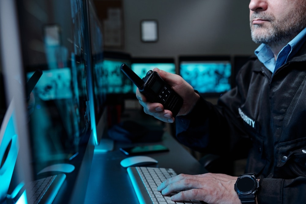 Cropped,Shot,Of,Mature,Male,Security,Guard,With,Walkie talkie,In