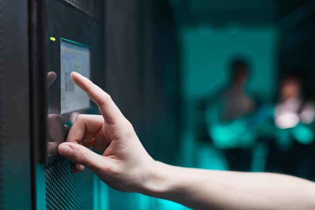 Man Operating Server Close Up